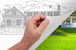 Male Hand Turning Page of Custom Home Photograph to Drawing Underneath. Male Hand Turning Page of Custom Home Photograph to Drawing Underneath.